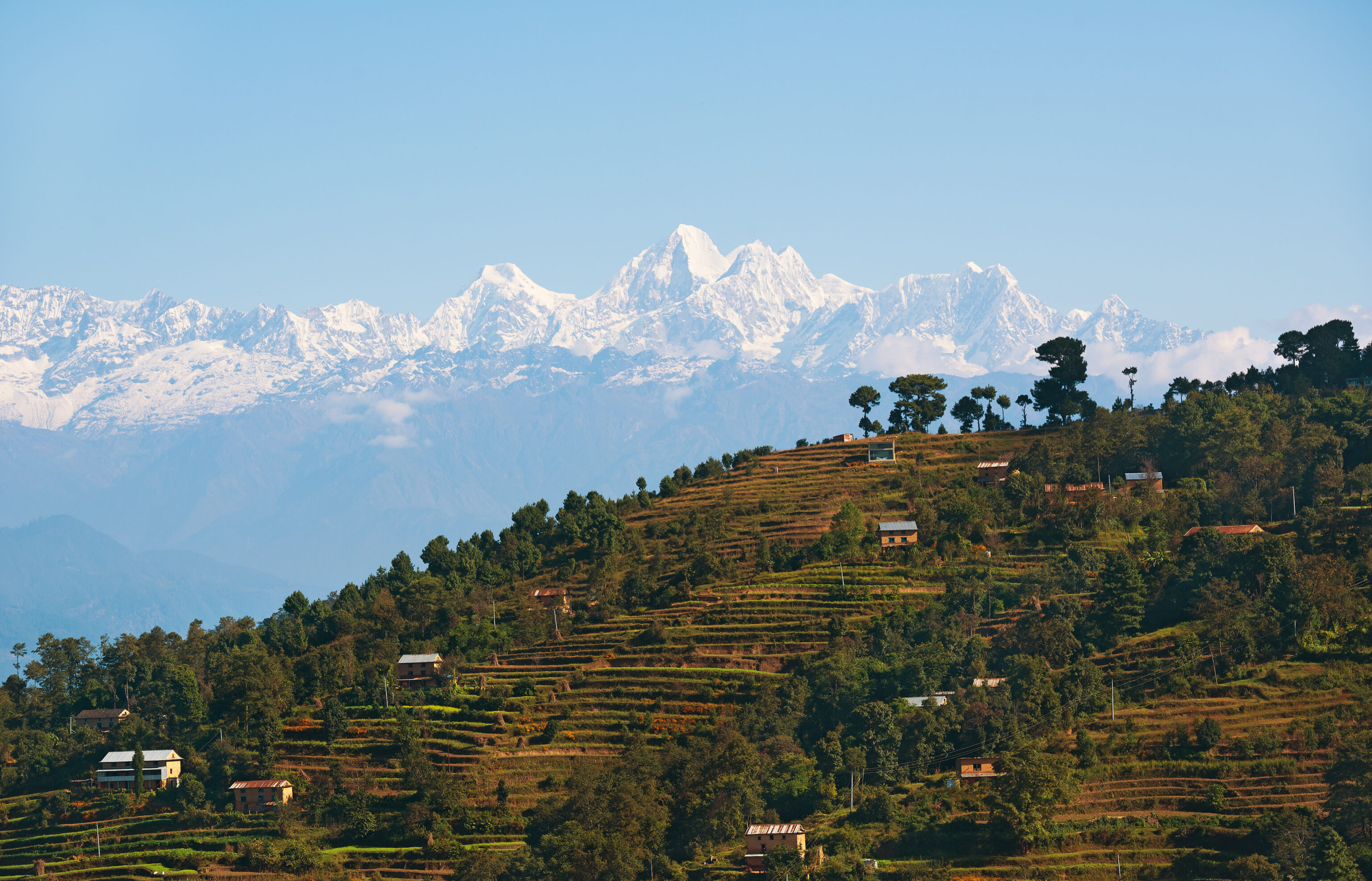 View,Of,Himalayan,Village,With,Mountain,Backdrop